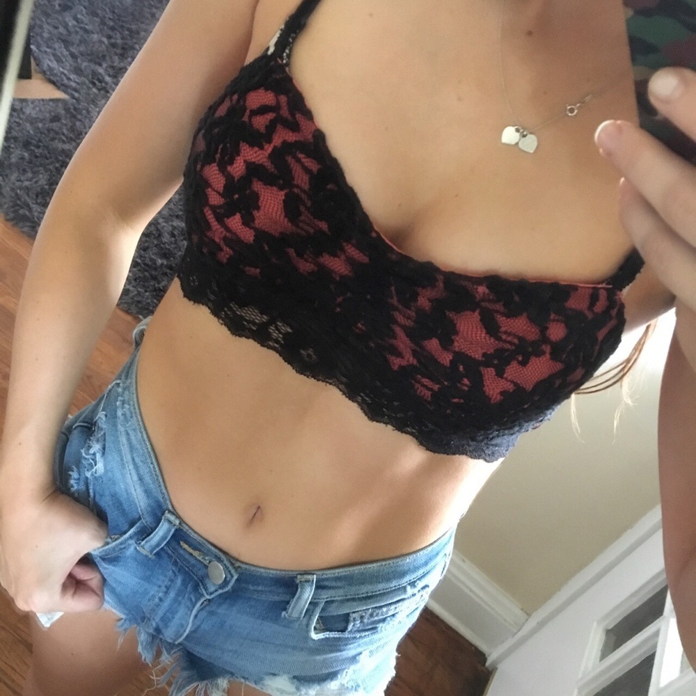 Coral/orange bralette with black lace detail